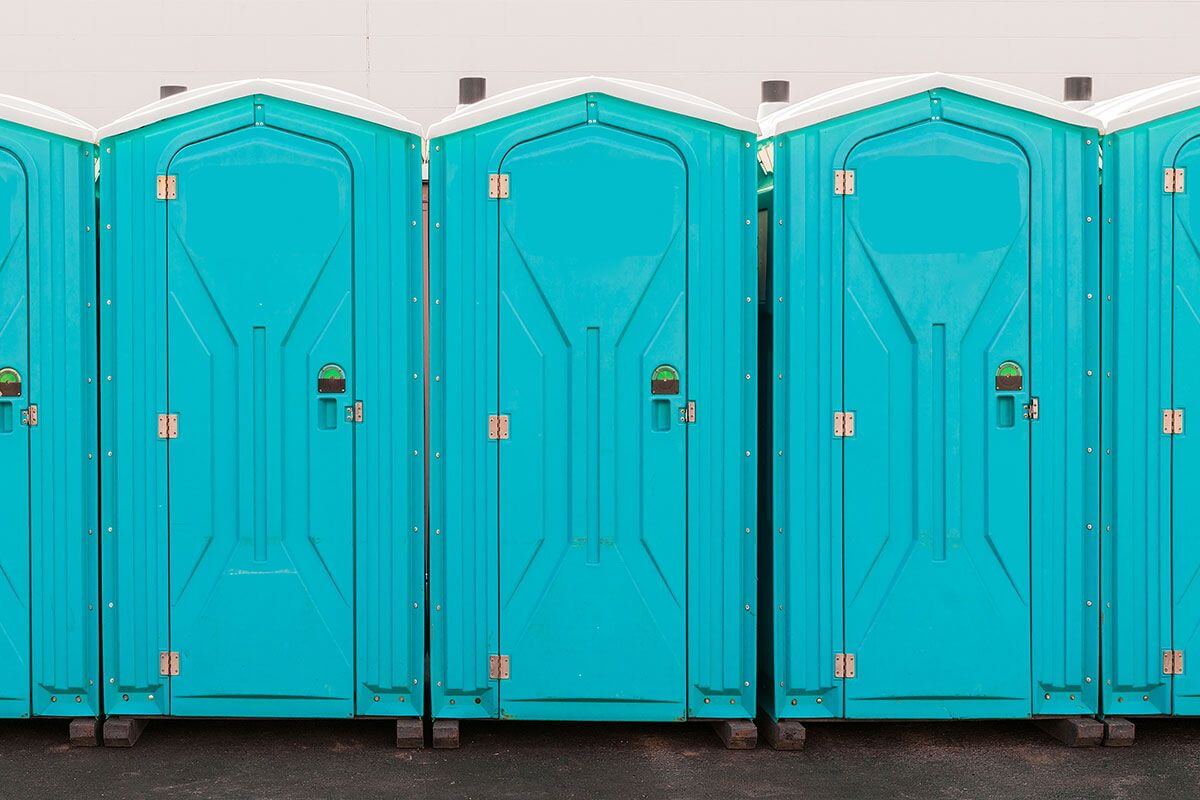 Industrial portable restroom units at a plant in Temecula, California